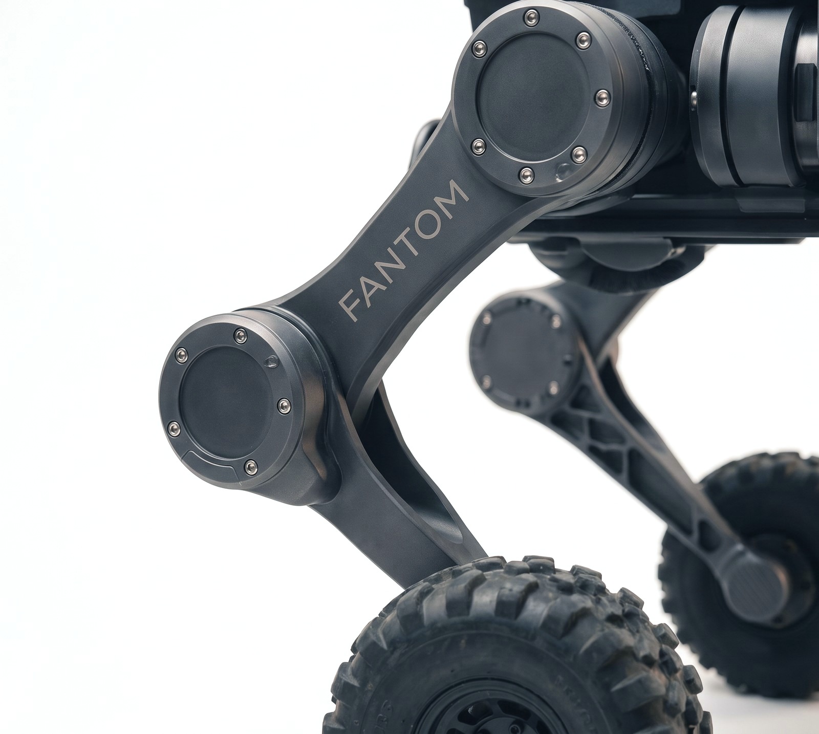 Macro detail of one HOUND leg, two disc actuators, sculpted link, knobby wheel