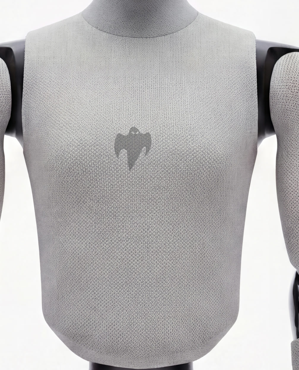 Macro detail of GHOST's marled technical knit torso with a tone-on-tone ghost emblem