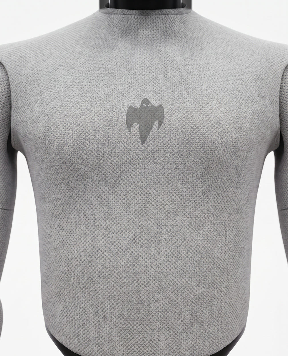 Macro detail of GHOST's marled technical knit torso with a tone-on-tone ghost emblem